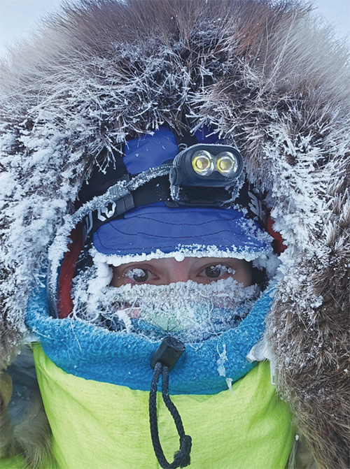 Iditarod  Musher with his dogs