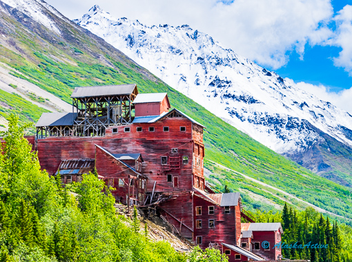 Historic wooden buildings and the dredge mill in Kennecott, Alaska